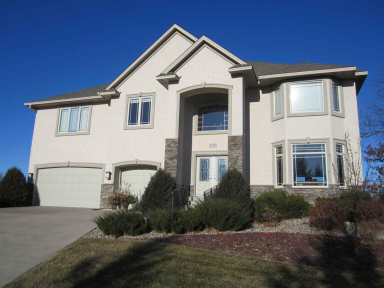 Front of home after stucco painting